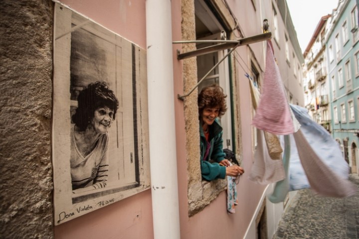 Woman on a window in Lisbon