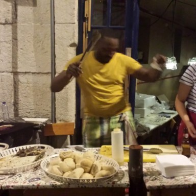Man dancing and cooking