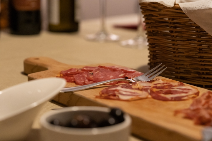 Platter of cold meats with a fork