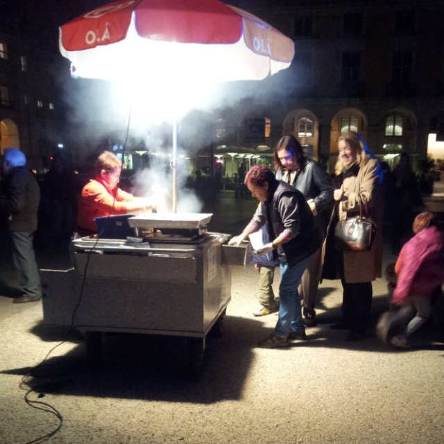 People buying hot chestnuts