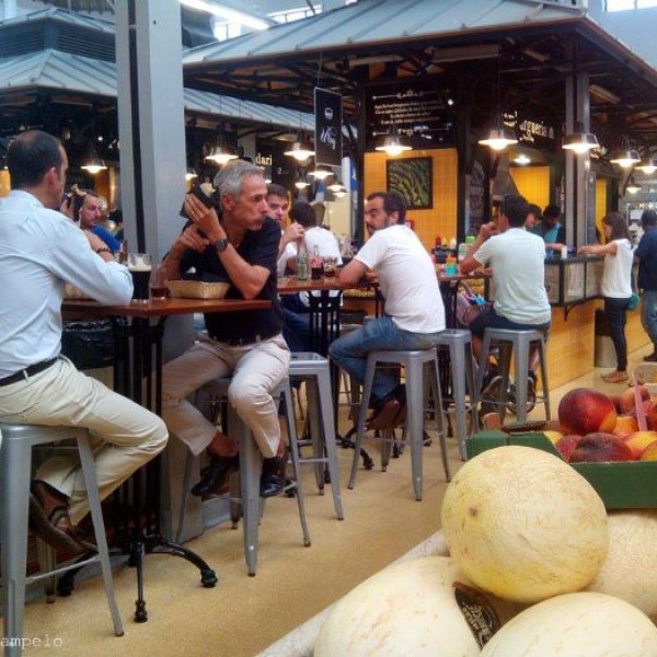 People having lunch at a food market