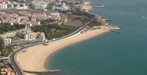 a large body of water with a city in the background
