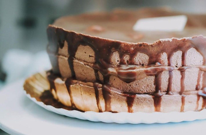 a close up of a piece of chocolate cake on a plate