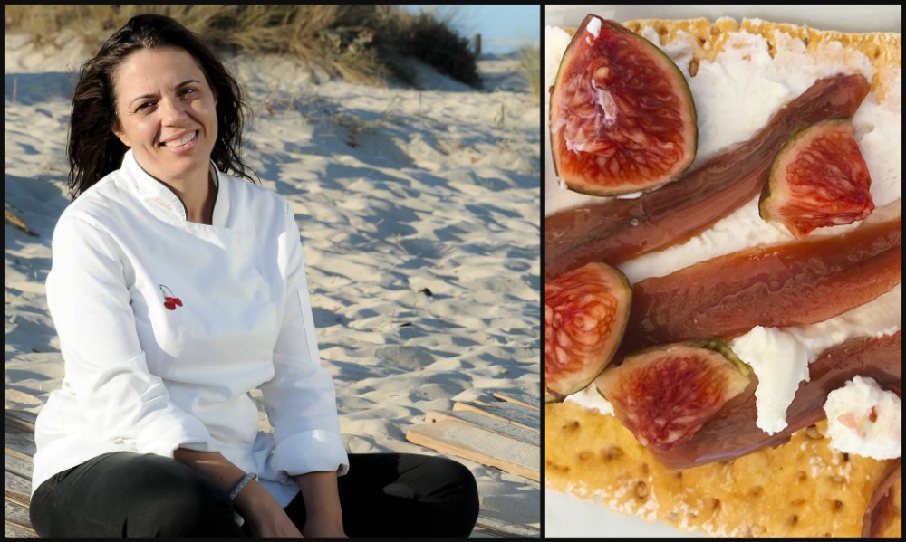 a person standing in front of a pizza