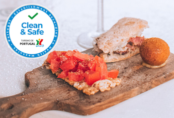 a sandwich sitting on top of a wooden cutting board