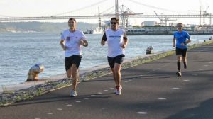 a group of people standing in a parking lot