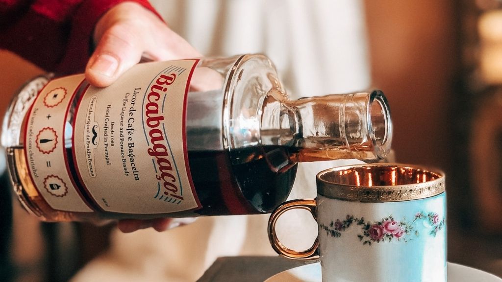 a close up of a bottle and a glass of wine