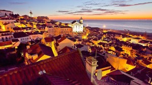 a group of people sitting at a beach