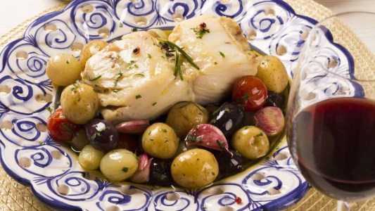 a plate of bacalhau on a table