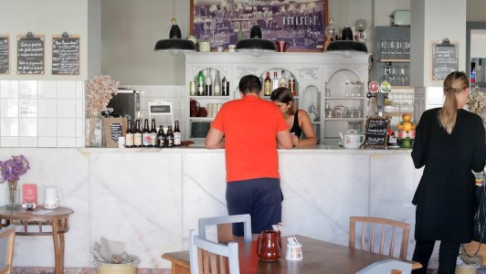 a man and a woman standing in a kitchen