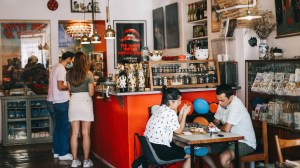 a group of people sitting at a table in a restaurant