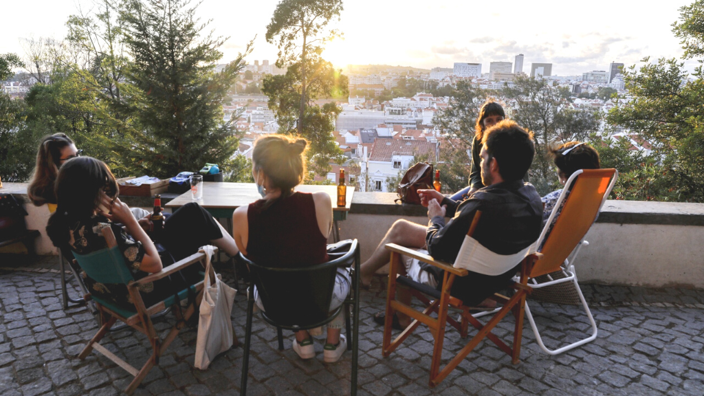 00.Penha de Franca travel guide_feat photo a group of people sitting at a table