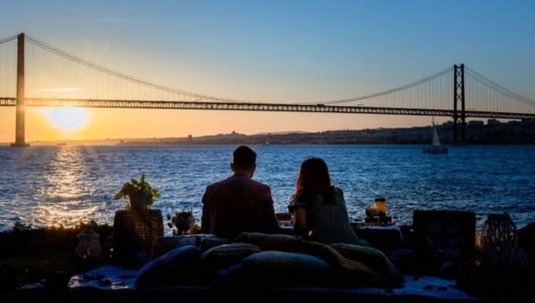 00.Sustainable things to do in Lisbon_feat photo a bridge over a body of water