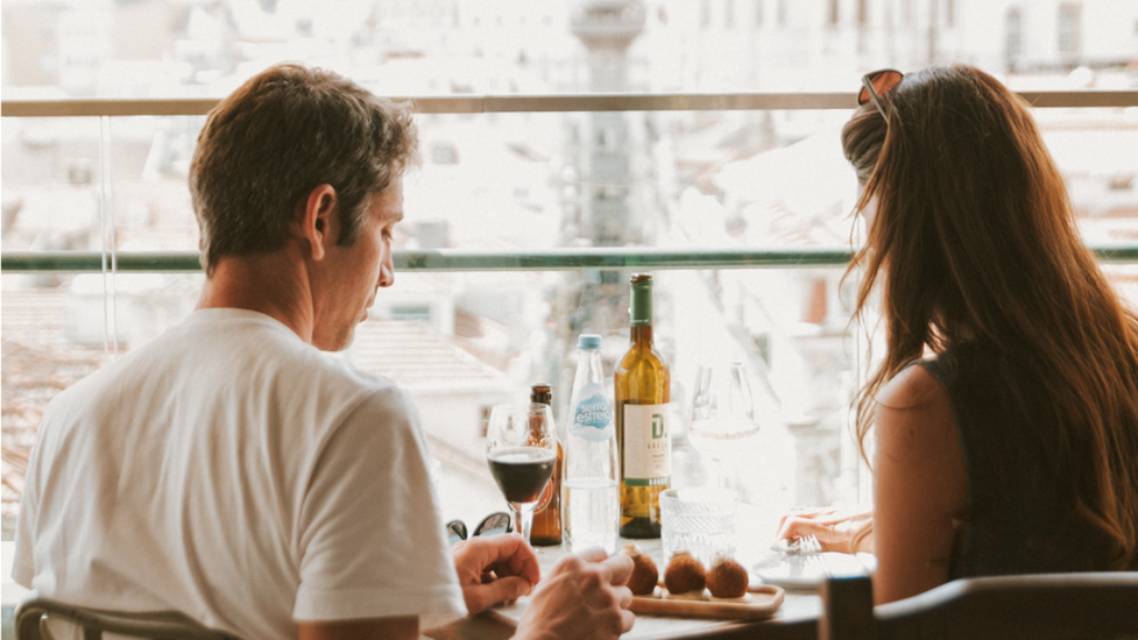 a man and woman preparing food in a kitchen