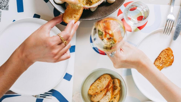 00.Portuguese flexitarian restaurants_feat photo a person holding a slice of pizza on a plate