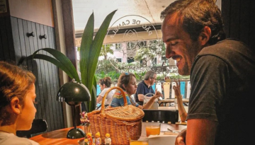 a man sitting at a table in a restaurant