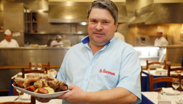 a man preparing food in a kitchen