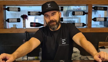 a man preparing food in a kitchen