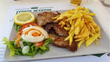a sandwich and fries on a plate