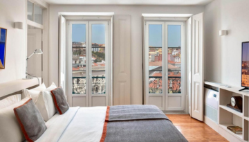 a bedroom with a large window
