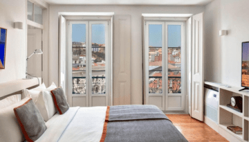 a bedroom with a large window
