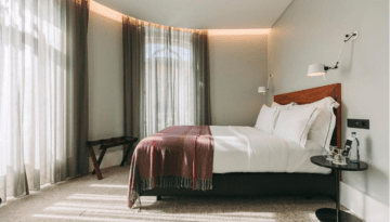 a bedroom with a bed in a hotel room