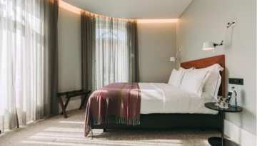 a bedroom with a bed in a hotel room