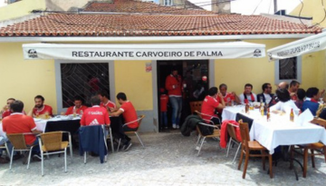 a group of people sitting at a table