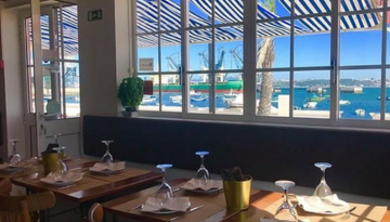 a dining room table in front of a window