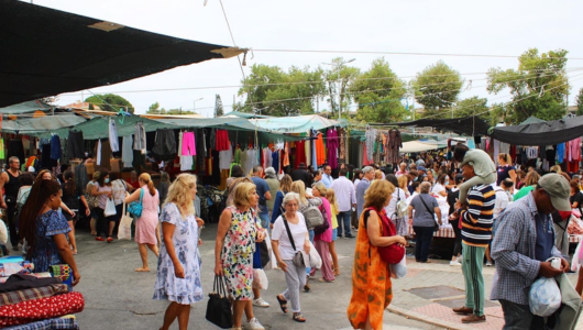 a group of people walking in front of a crowd
