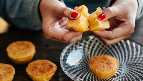 00.Torres Vedras travel guide for food lovers_feat photo a close up of a person holding a piece of bread