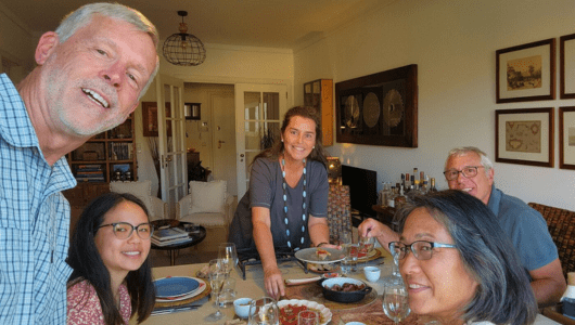 a group of people sitting at a dinner table