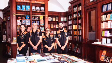 a group of people in a library