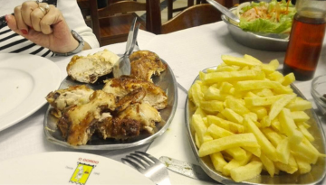 a table topped with a sandwich and fries on a plate