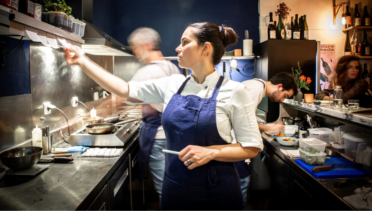 a person cooking in a kitchen preparing food