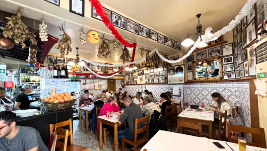 a group of people sitting at a table in a restaurant