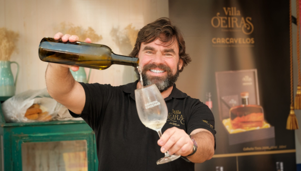 a man holding a glass of wine