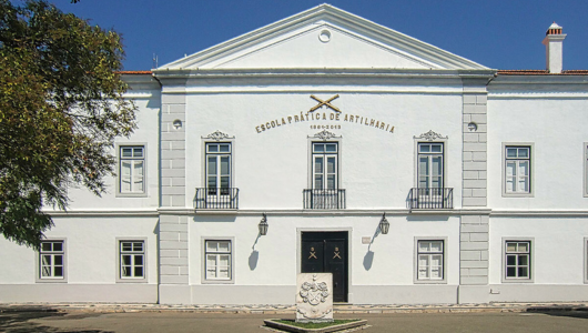 a clock tower in front of a building