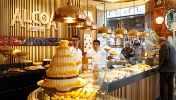 a person preparing food inside of a store
