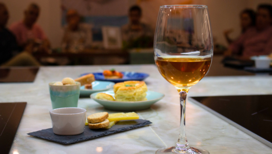 a group of people sitting at a table with wine glasses
