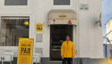 a man standing in front of a building