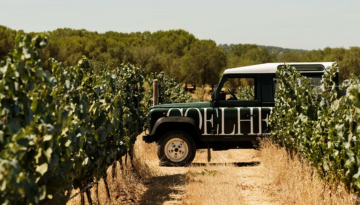 a truck driving down a dirt road