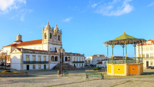 a clock tower in front of a building
