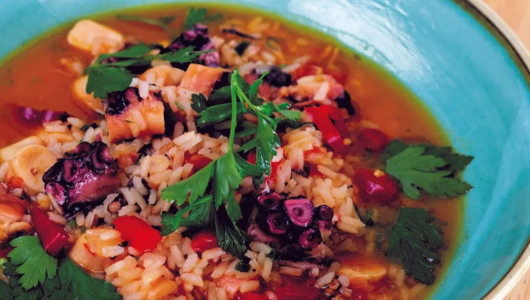 a close up of a bowl of food on a plate