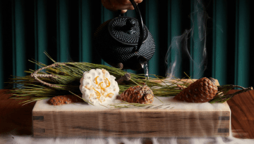 a vase that has some food on a table