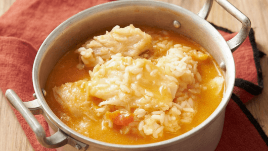 a bowl of soup and a spoon