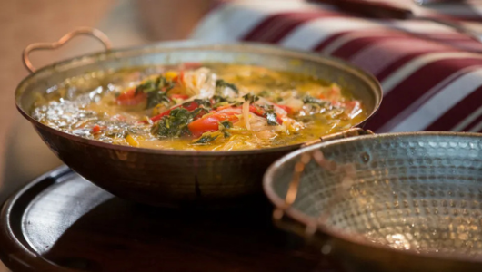 a bowl of food on a metal pan