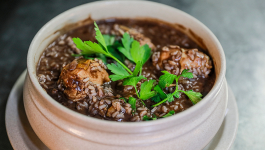 a close up of a bowl of food on a plate