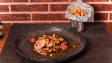 a plate of food on a wooden table