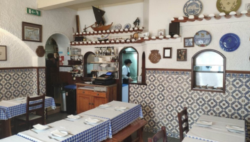 a kitchen with a table in a room